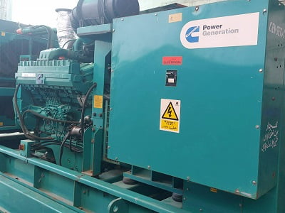 A heavy green colored power generator for rental service by hudson engineering Rental Generator Service by Hudson Engineering
